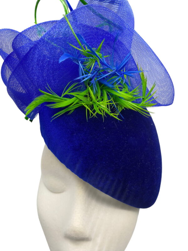 Blue velvet teardrop headpiece with blue crin and green & blue feathered detail.